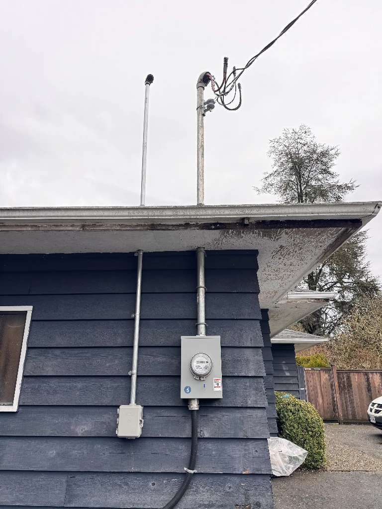 200A service mast installation