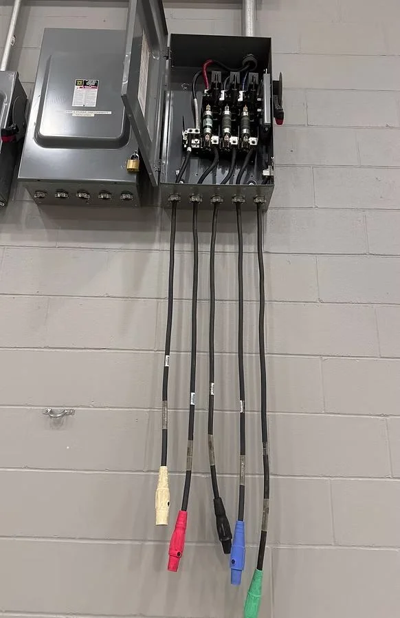 Licensed electrician completing electrical installation